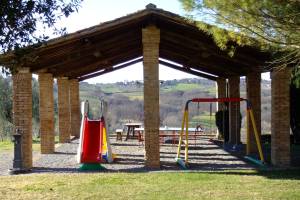 Children playground in Chianti at the Monaciano farm holiday countryhouse with ping-pong